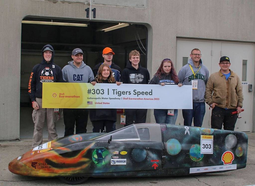 The Granite Falls Eco-Car team with their battery electric prototype car at the Shell Eco-Marathon at the Indianapolis Motor Speedway in April. (Photo courtesy of the Granite Falls High School)