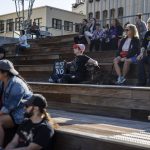 People gather at the Snohomish County Campus to rally against the no sit, no lie expansion on Wednesday, May 3, 2023 in Everett, Washington. (Olivia Vanni / The Herald)