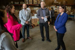 U.S. Congresswoman Suzan DelBene (right to left) speaks with Volunteers of America Western Washington Director of Operations Dean Johnson, CEO Brian Smith and Homage dietitians at their food distribution center on Monday, May 1, 2023 in Everett, Washington. (Olivia Vanni / The Herald)