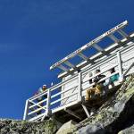 Hikers enjoy the catwalk around the Mount Pilchuck fire lookout in early November 2019. (Caleb Hutton / The Herald)