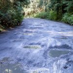 Ruts on Mt. Pilchuck Road Wednesday afternoon in Granite Falls, Washington on September 7, 2022. Construction and repairs on the road will start this summer. (Kevin Clark / The Herald)