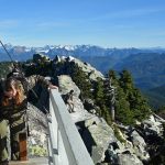 Hikers soak up the sun and views near the Mount Pilchuck fire lookout in early November 2019. (Caleb Hutton / The Herald)