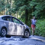Carolanne Warren directs her mother through the ruts on Mt. Pilchuck Road Wednesday afternoon in Granite Falls, Washington on September 7, 2022. Construction and repairs on the road will start this summer. (Kevin Clark / The Herald)