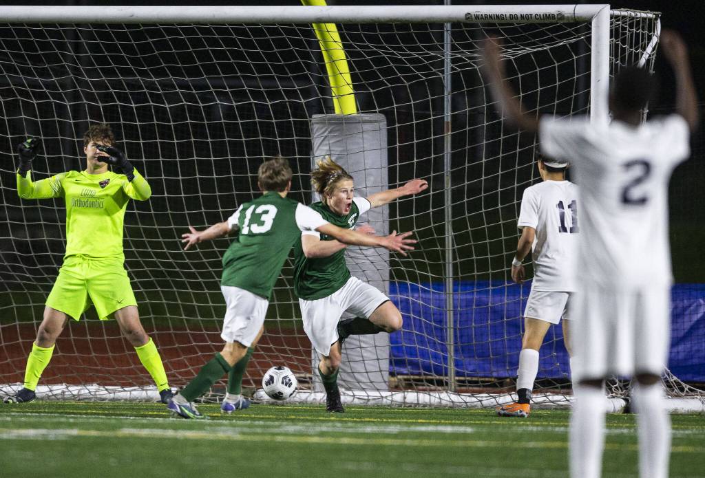 Edmonds-Woodways Kincaid Sund reacts to scoring the game winning goal in overtime against Everett on Monday, May 1, 2023 in Edmonds, Washington. (Olivia Vanni / The Herald)