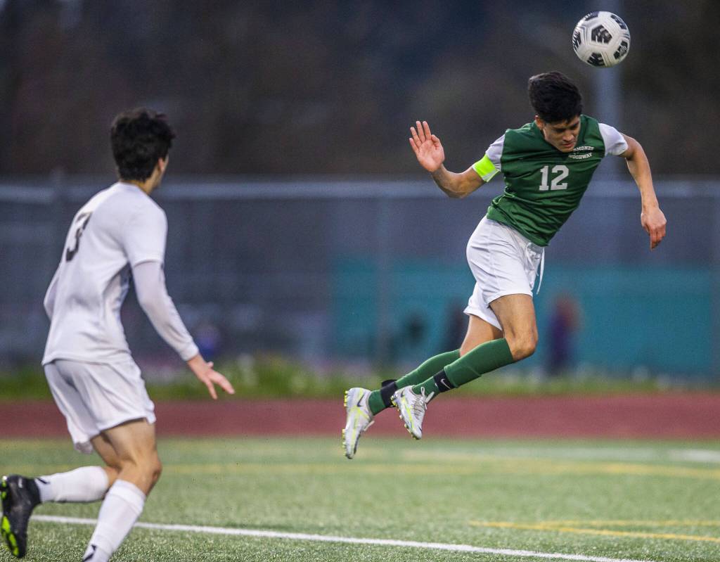 Edmonds-Woodways Victor Ibarra heads the ball in for a goal during the game against Everett on Monday, May 1, 2023 in Edmonds, Washington. (Olivia Vanni / The Herald)