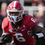 Georgia running back Kenny McIntosh carries the ball during the first half of a game against Georgia Tech on Nov. 26, 2022, in Athens, Ga. (AP Photo/John Bazemore)