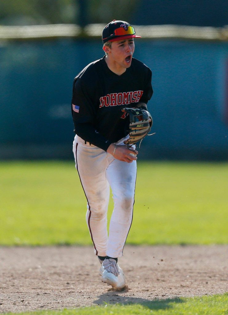 A Snohomish infielder celebrates a double play to keep the score tied during a close game against Arlington on Friday, April 14, 2023, at Earl Torgeson Field in Snohomish, Washington. (Ryan Berry / The Herald)