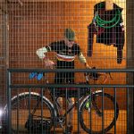 Phillip Buffington locks up his bike and gathers some of his gear before heading into work at the Everett Public Library. (Ryan Berry / The Herald)
