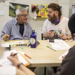 Joseph Anderson, right, chats with Steve Manshour during Art Studio time at the Everett Recovery CaFE on Wednesday, May 10, 2023 in Everett, Washington. (Olivia Vanni / The Herald)