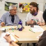 Joseph Anderson, right, chats with Steve Manshour during Art Studio time at the Everett Recovery CaFE on Wednesday, May 10, 2023 in Everett, Washington. (Olivia Vanni / The Herald)