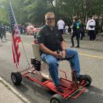 J.D. Stollwerck rides the go-kart parade float that was stolen Saturday night from his business, Stollwerck Plumbing & Sewer in Mukilteo. (Submitted photo)
