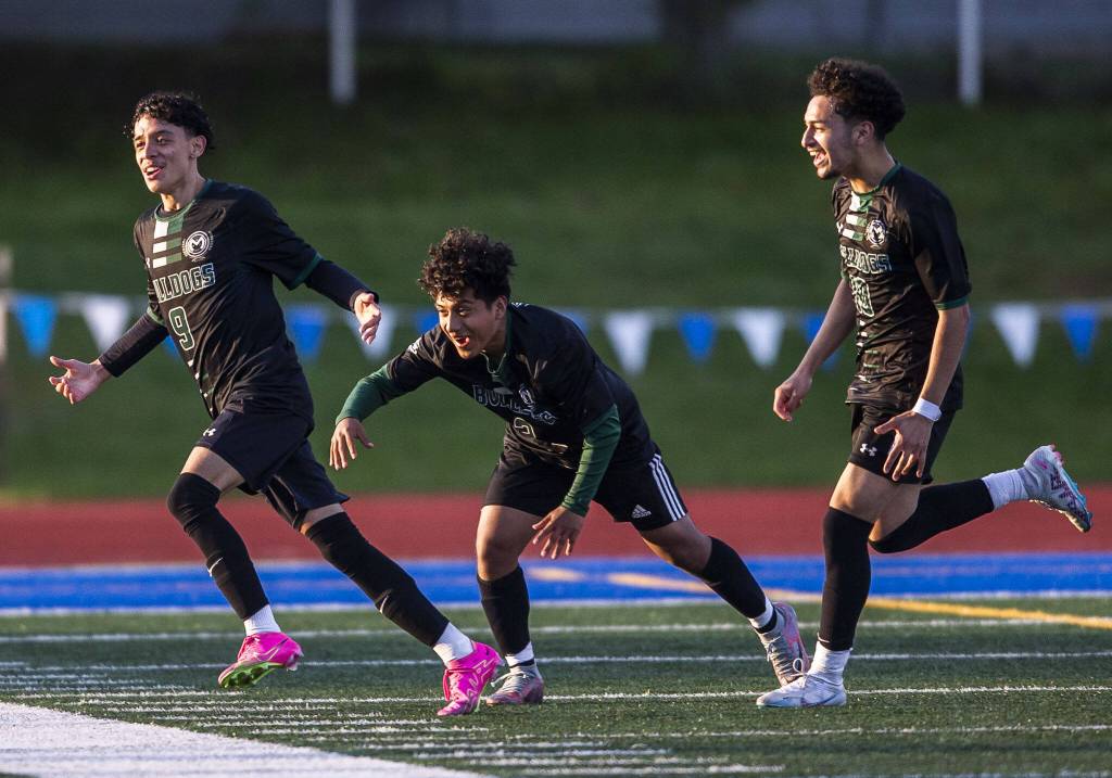 Mount Vernon players celebrate beating Mountlake Terrace on Tuesday, May 9, 2023 in Shoreline, Washington. (Olivia Vanni / The Herald)