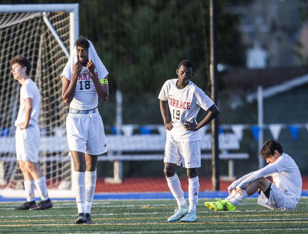Mountlake Terrace players react to losing to Mount Vernon in overtime on Tuesday, May 9, 2023 in Shoreline, Washington. (Olivia Vanni / The Herald)