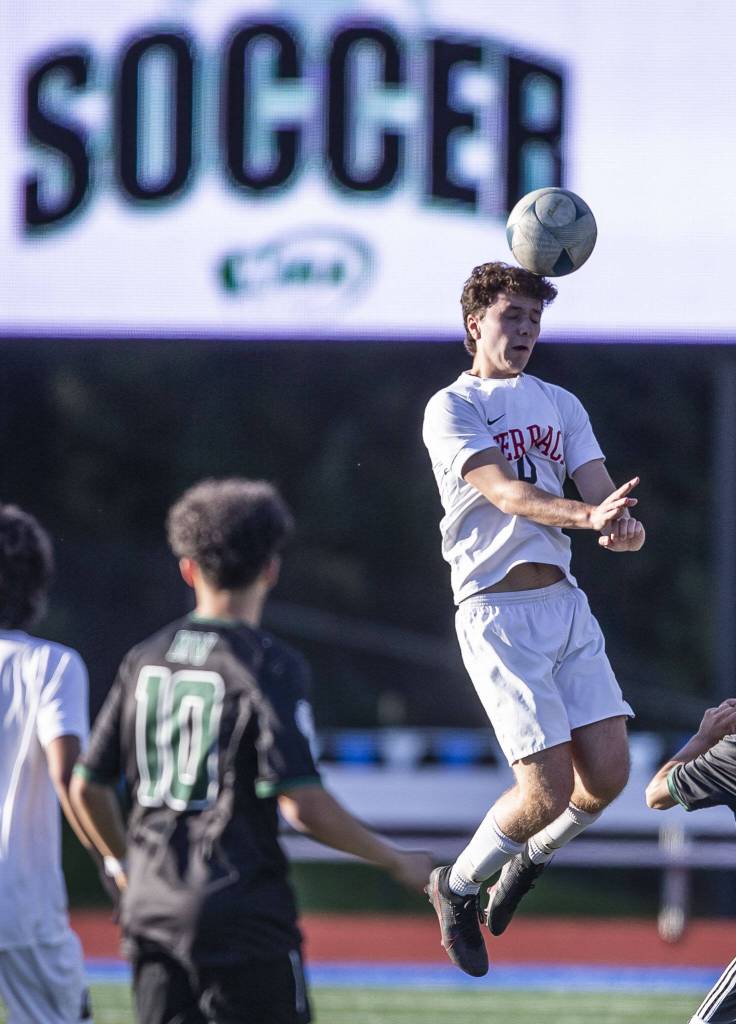 Mountlake Terraces Kyle Mervin heads the ball during the game against Mount Vernon on Tuesday, May 9, 2023 in Shoreline, Washington. (Olivia Vanni / The Herald)