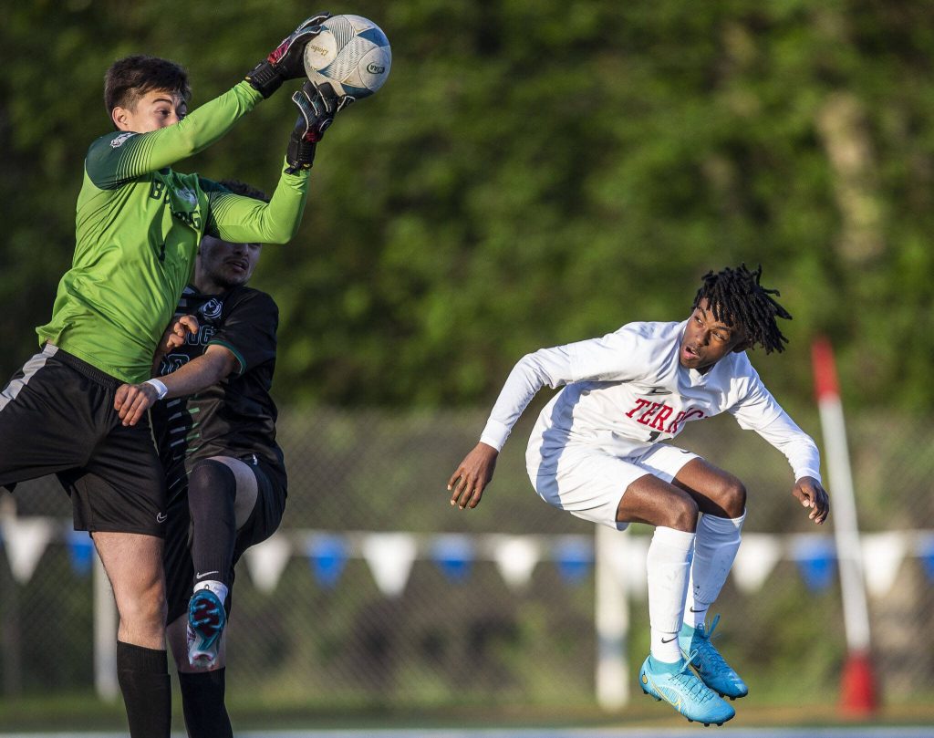 Mountlake Terraces Ash Jeffers ducks while jumping for the ball during the game against Mount Vernon on Tuesday, May 9, 2023 in Shoreline, Washington. (Olivia Vanni / The Herald)