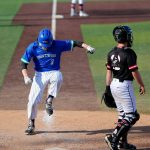 Shorewoods Noah Fahey stomps on home plate to score the go-ahead run against Mountlake Terrace in a Wesco 3A District 1 semifinal on Tuesday, May 9, 2023, at Funko Field in Everett, Washington. (Ryan Berry / The Herald)
