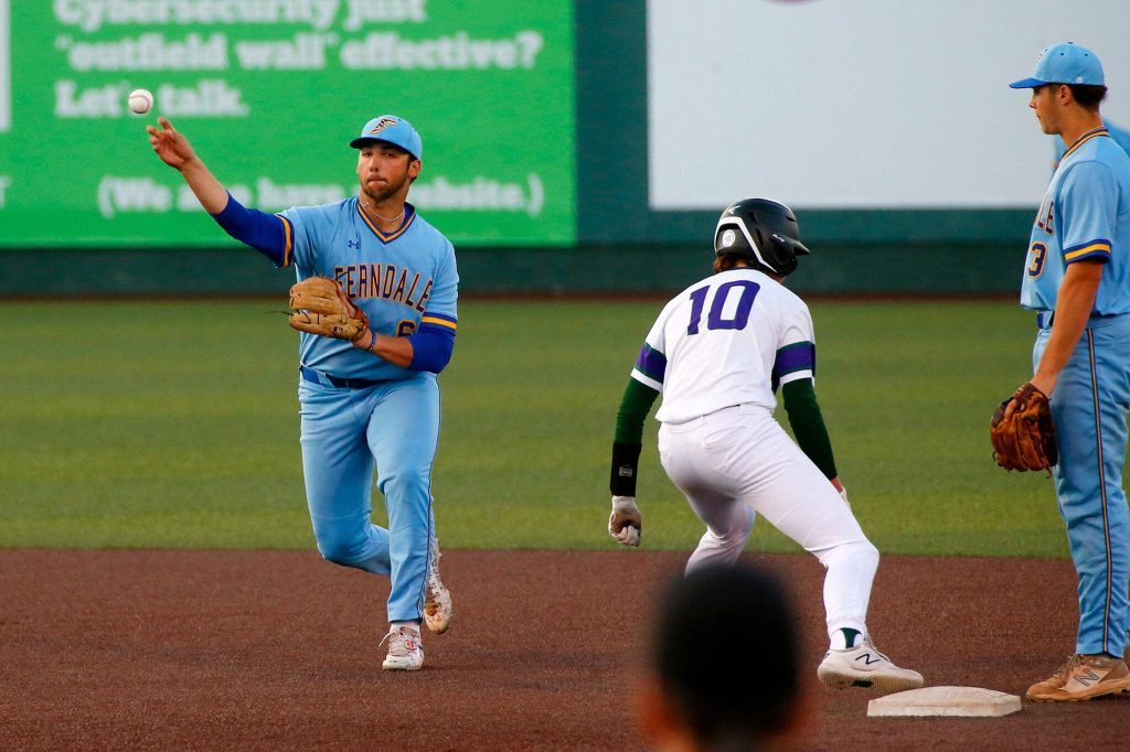 Ferndales Jake Mason throws out a runner at first against Edmonds-Woodway in a Wesco 3A District 1 semifinal on Tuesday, May 9, 2023, at Funko Field in Everett, Washington. (Ryan Berry / The Herald)