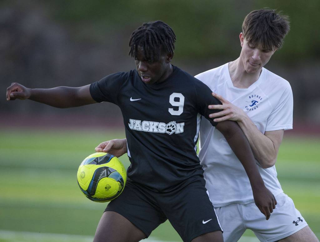 Jacksons Jaden Oguda traps the ball during the game against Bothell on Thursday, May 11, 2023 in Everett, Washington. (Olivia Vanni / The Herald)