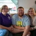 Joy Hochstetler, right, sits with her twin Joshua and their mom, Mae Hochstetler, at the home where Mae and Joshua live on Friday, Feb. 24, 2023, in Lynnwood, Washington. (Ryan Berry / The Herald)