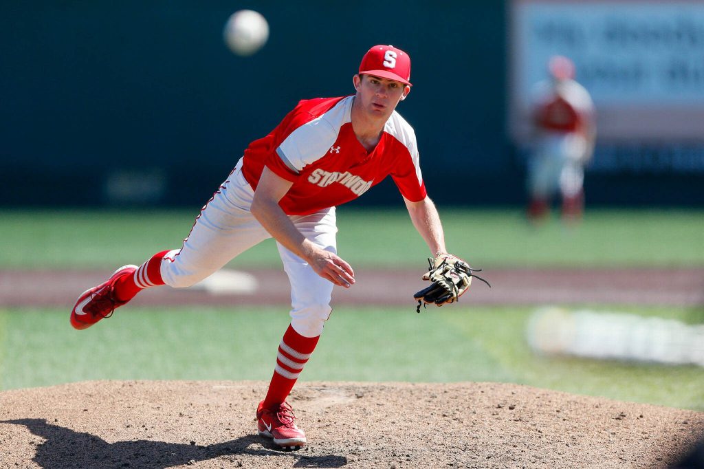 Stanwood pitcher Matthew Brennan follows his pitch off the mound on a bunt attempt against Monroe in a winner-to-state consolation game on Saturday, May 13, 2023, at Funko Field in Everett, Washington. (Ryan Berry / The Herald)
