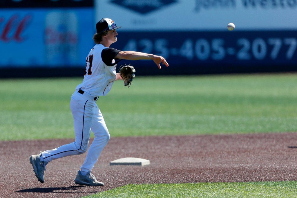 Monroe’s Ethan Hogan throws out a runner from shortstop against Stanwood in a winner-to-state consolation game on Saturday, May 13, 2023, at Funko Field in Everett, Washington. (Ryan Berry / The Herald)
