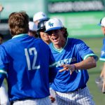 Shorewood players come out to celebrate with Blake Gettmann (12) after he scored the tying run against Mountlake Terrace in a Class 3A District 1 semifinal on May 9 at Funko Field in Everett. (Ryan Berry / The Herald)
