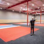 Kevin Aiello walks on the soon to be finished indoor pickle ball courts on Friday, May 19, 2023 in Marysville, Washington. (Olivia Vanni / The Herald)