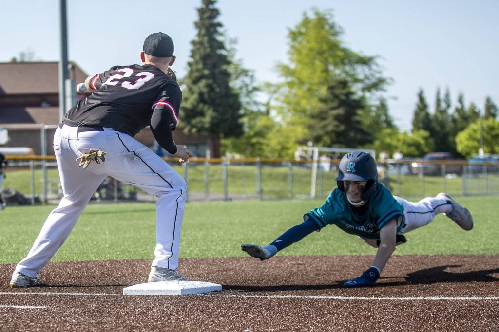 Mountlake Terraces Ethan Swenson (23) catches at first during a game between Mountlake Terrace and Auburn Riverside in Mountlake Terrace, Washington on Tuesday, May 16, 2023. Mountlake Terrace won, 13-3. (Annie Barker / The Herald)