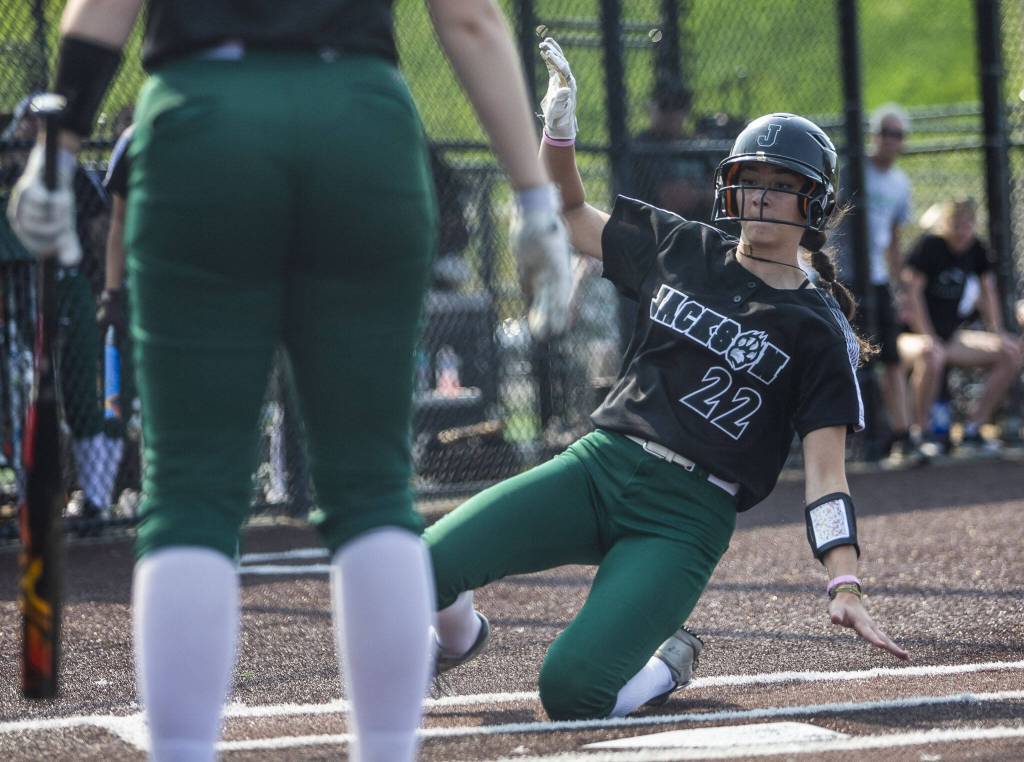 Jacksons Allie Thomsen slides into home to score during the game against Skyline on Wednesday, May 17, 2023 in Everett, Washington. (Olivia Vanni / The Herald)