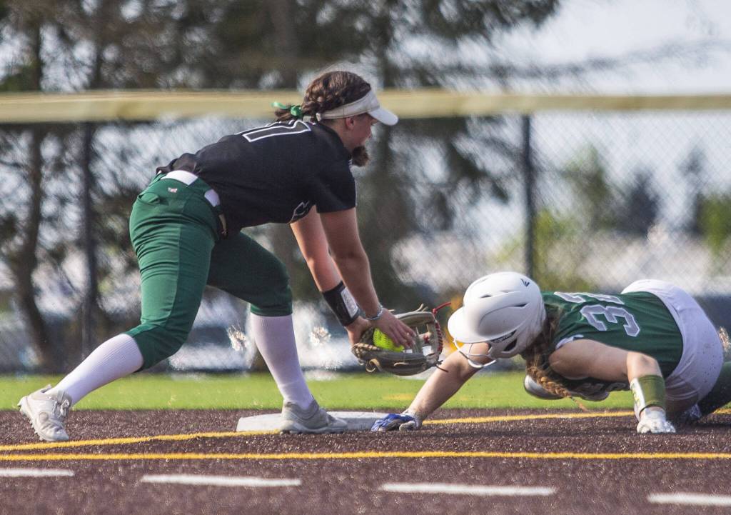 Jacksons Rachel Sysum reaches out for a tag out during the game against Skyline on Wednesday, May 17, 2023 in Everett, Washington. (Olivia Vanni / The Herald)