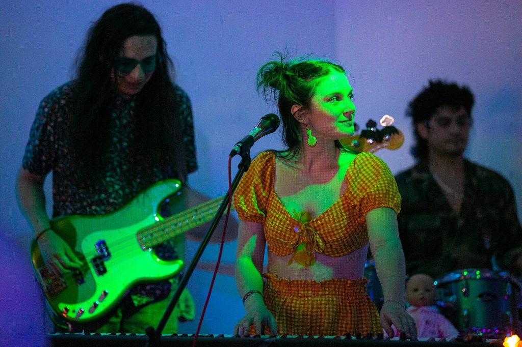 Local band Narrow Tarot perform as a crowd builds at Lucky Dime during the opening night of Fishermans Village on Thursday, May 18, 2023, in downtown Everett, Washington. (Ryan Berry / The Herald)