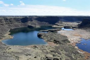 A view of Dry Falls from the catwalk overlooking the 3.5-mile scalloped precipice — which 20,000 years ago was five times the width of Niagara Falls with 10 times the flow of all the current rivers in the world combined — on Saturday, April 22, 2023. Dominick Bonny photo/Crosscut
