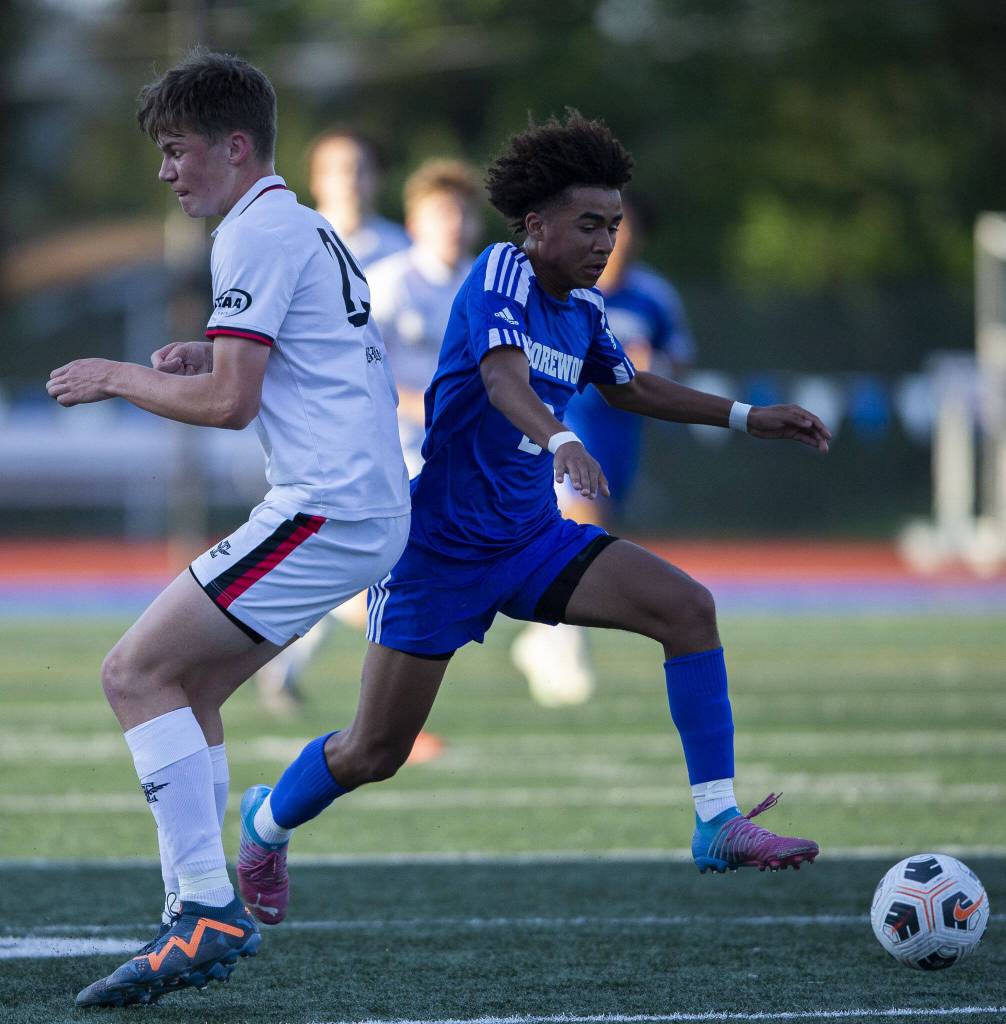 Shorewoods Jackson Smith cuts left to get around a defender on a breakaway during the game against Ballard on Thursday, May 18, 2023 in Shoreline, Washington. (Olivia Vanni / The Herald)