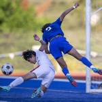 Shorewoods Jackson Smith leaps in the hair for a head ball in front of the goal during the game against Ballard on Thursday, May 18, 2023 in Shoreline, Washington. (Olivia Vanni / The Herald)