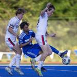 Shorewoods Matthew Bereket is knocked down as he tries to get a shot off in the goal box during the game against Ballard on Thursday, May 18, 2023 in Shoreline, Washington. (Olivia Vanni / The Herald)
