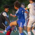Shorewoods Jackson Smith is beat to the ball by Ballards goalkeeper during the game against Ballard on Thursday, May 18, 2023 in Shoreline, Washington. (Olivia Vanni / The Herald)