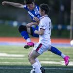 Shorewoods Ilya Mohav leaps to make a tackle during the game against Ballard on Thursday, May 18, 2023 in Shoreline, Washington. (Olivia Vanni / The Herald)
