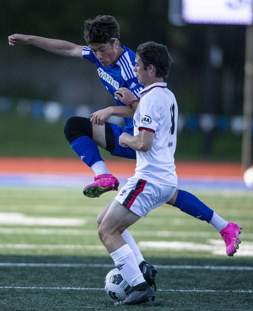 Shorewoods Ilya Mohav leaps to make a tackle during the game against Ballard on Thursday, May 18, 2023 in Shoreline, Washington. (Olivia Vanni / The Herald)