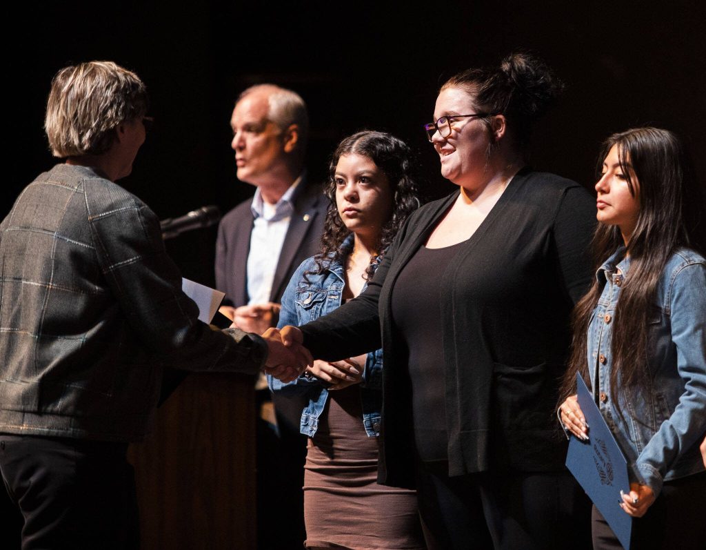 Morgan Gidney receives an AVID Scholarship during the Rotary Club of Everett Awards on Monday, May 22, 2023 in Everett, Washington. (Olivia Vanni / The Herald)