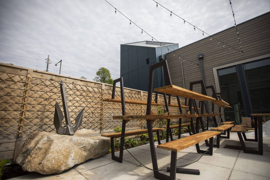 The outside patio of the Sound2Summit Craft Brewery in Everett Marina Village at the Port of Everett on Wednesday, May 24, 2023 in Everett, Washington. (Olivia Vanni / The Herald)