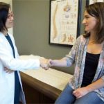 Dr. Yee with a patient.