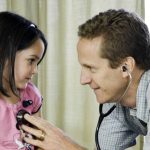 Dr. Lindstrom with a pediatric patient.