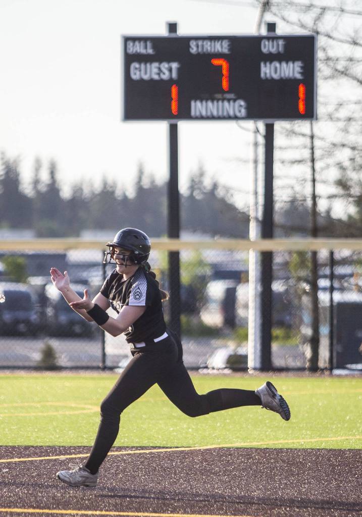 Jacksons Hailey Pelletier claps while running the bases after hitting a homer to give Jackson the lead during the game against Bothell on Friday, May 19, 2023 in Everett, Washington. (Olivia Vanni / The Herald)