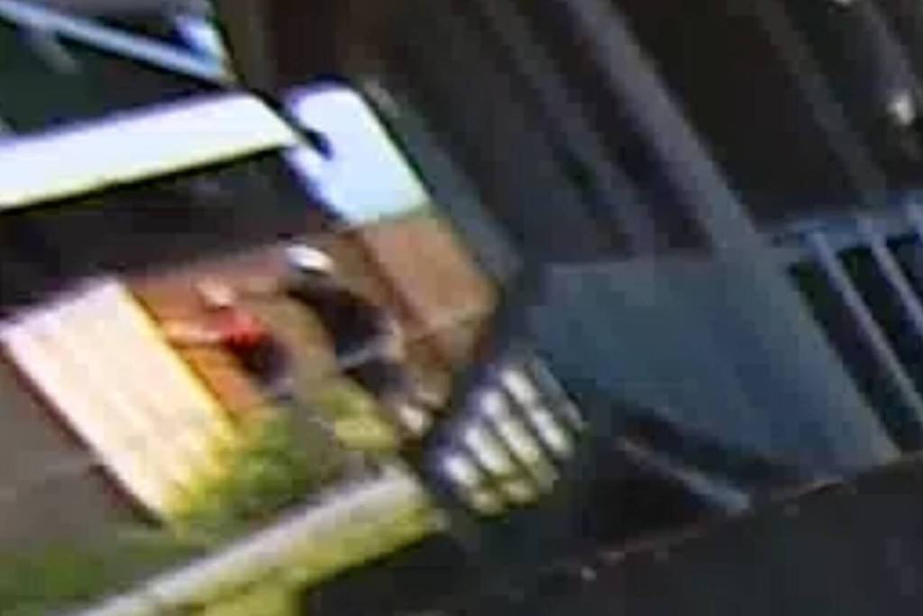 A screenshot from security footage from a neighbor who wished to remain anonymous appears to show police opening fire on a suspect accused of shooting sheriff’s deputies.