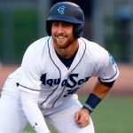 AquaSox first baseman Tyler Locklear smiles while taking a leadoff after getting on base in his first at bat during the season opener against the Eugene Emeralds on Friday, April 7, 2023, at Funko Field in Everett, Washington. (Ryan Berry / The Herald)