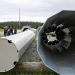 Sections of metal power poles lie in a temporary yard as work continues on a project improving power infrastructure between Stanwood and Camano Island on Tuesday, May 30, 2023, in Camano, Washington. (Ryan Berry / The Herald)