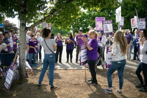 A crowd of SEIU Healthcare 1199NW members and supporters gather to listen to speakers addresses the group during a union picket in front of EvergreenHealth Monroe on Wednesday, May 24, 2023, in Monroe, Washington. (Ryan Berry / The Herald)