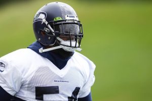 Seattle Seahawks linebacker Bobby Wagner jogs onto the field Monday, May 22, 2023, at the team's NFL football training facility in Renton, Wash. (AP Photo/Lindsey Wasson)