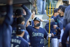 The Mariners Ty France celebrates in the dugout after his solo home run during the sixth inning of a game aginst the Athletics on Thursday in Seattle. (AP Photo/John Froschauer)