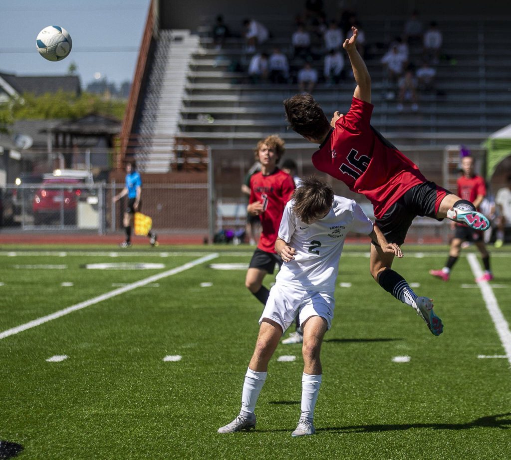 Edmonds-Woodways Alexander Bryan (2) and Lincolns Ethan Roberts (16) fight for the ball during a game between Edmonds-Woodway and Lincoln of Seattle at Sparks Stadium in Puyallup, Washington on Friday, May 26, 2023. Edmonds-Woodway lost, 6-1. (Annie Barker / The Herald)